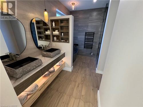 Bathroom with walk in shower, wood-type flooring, and vanity - 40 Masson Lane, Callander, ON - Indoor Photo Showing Other Room