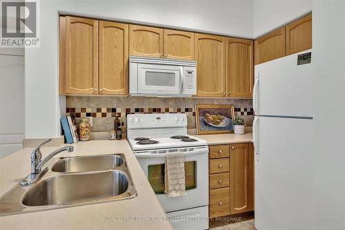 304 - 869 Clonsilla Avenue, Peterborough (Monaghan), ON - Indoor Photo Showing Kitchen With Double Sink