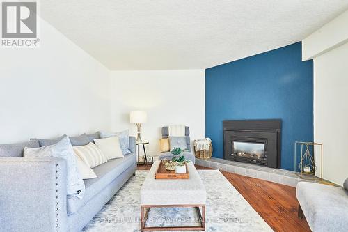 59 - 209472 Highway 26, Blue Mountains, ON - Indoor Photo Showing Living Room With Fireplace