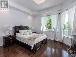 Beautiful Primary Bedroom with coffered ceiling overlooking the backyard, walk-in closet and luxurious 5 piece ensuite. - 