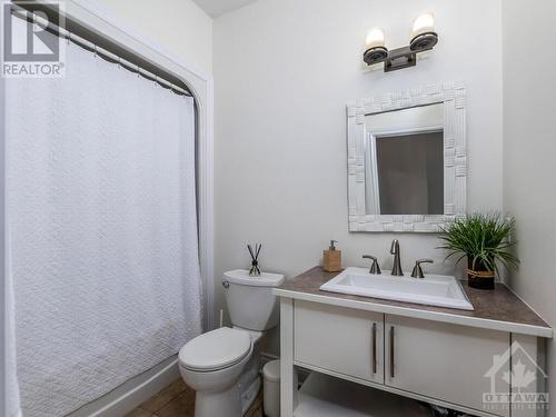 Main Floor 4 piece bath. Perfect for guests and conveniently located off garage inside entry. - 50 Frances Colbert Avenue, Ottawa, ON - Indoor Photo Showing Bathroom