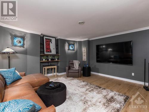 Fantastic Home theatre room wired for surround sound, projection TV and mood lighting. - 50 Frances Colbert Avenue, Ottawa, ON - Indoor Photo Showing Living Room