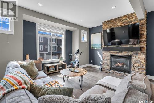 20 425 Langer Place, Warman, SK - Indoor Photo Showing Living Room With Fireplace