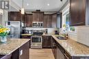 20 425 Langer Place, Warman, SK  - Indoor Photo Showing Kitchen With Stainless Steel Kitchen With Double Sink With Upgraded Kitchen 