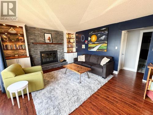 10693 Cottonwood Crescent, Dawson Creek, BC - Indoor Photo Showing Living Room With Fireplace