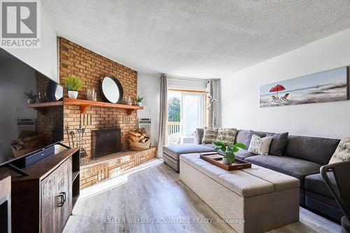 44 - 209472 Highway 26, Blue Mountains, ON - Indoor Photo Showing Living Room With Fireplace