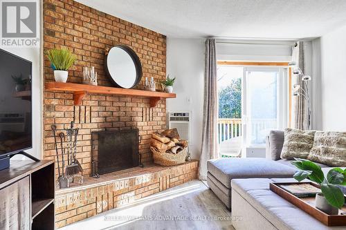 44 - 209472 Highway 26, Blue Mountains, ON - Indoor Photo Showing Living Room With Fireplace