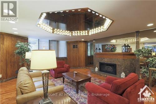 603 - 2871 Richmond Road, Ottawa, ON - Indoor Photo Showing Living Room With Fireplace