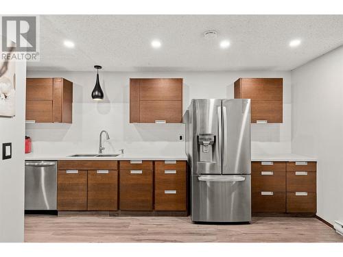 983 Bernard Avenue Unit# 105, Kelowna, BC - Indoor Photo Showing Kitchen With Double Sink