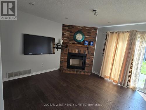 18 Samson Court, Brampton, ON - Indoor Photo Showing Living Room With Fireplace