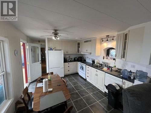 7511 Highland Drive, Fort Nelson, BC - Indoor Photo Showing Kitchen With Double Sink