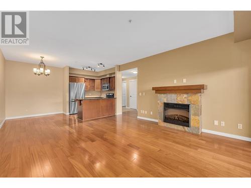 2142 Vasile Road Unit# 214, Kelowna, BC - Indoor Photo Showing Living Room With Fireplace