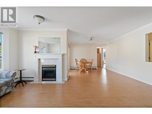 250 5 Street Se Unit# 307, Salmon Arm, BC - Indoor Photo Showing Living Room With Fireplace