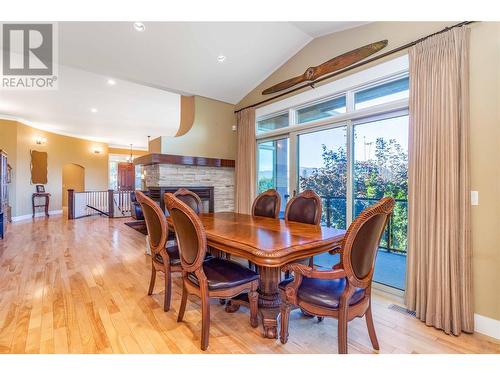 5016 Seon Crescent, Kelowna, BC - Indoor Photo Showing Dining Room With Fireplace