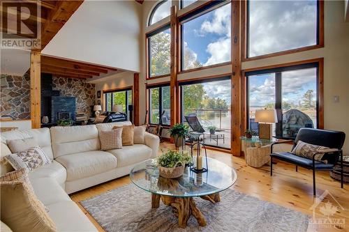 Main Level Deck - 122 Red Rock Bay Road, Perth, ON - Indoor Photo Showing Living Room With Fireplace