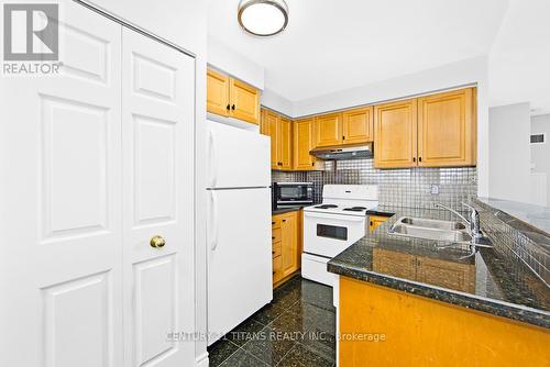 1605 - 7 Lorraine Drive, Toronto, ON - Indoor Photo Showing Kitchen With Double Sink