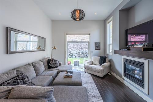 102-14395 Herron Road, Summerland, BC - Indoor Photo Showing Living Room With Fireplace