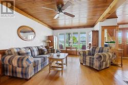 Living room - Note the majority of all main level flooring is hardwood, installed in the late 80s/early 90s.  The only close neighbour's home is seen the window, it has been meticulously renovated - 