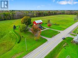 Exterior front showing paved circular drive & only close neighbour's home across the road-Road is very rural, busy in early morning and at end of day. - 