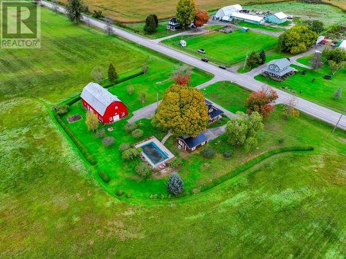 Overhead photo showing steel roofing on all 3 buildings and the pool area.   Note the gorgeous mature trees, shrubs and if you have a magnifying glass you can see the mature gardens. - 2176 County Road 22 Road, Cardinal, ON - Outdoor With View