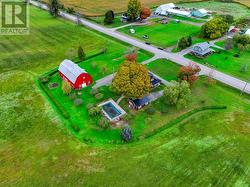 Overhead photo showing steel roofing on all 3 buildings and the pool area.   Note the gorgeous mature trees, shrubs and if you have a magnifying glass you can see the mature gardens. - 