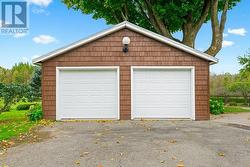 23 x 26 ft garage with 2 new 8 ft doors 2024 & steel covered roof 2023. - 