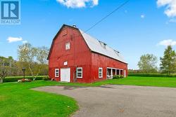 65 x 35 ft storage building / barn with concrete floor, steel roofing & second level hayloft/storage - 