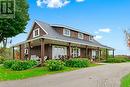 Exterior front showing huge wrap around covered veranda on 3 sides of awesome home-  Kick back & watch the awesome country sunrises. - 2176 County Road 22 Road, Cardinal, ON  - Outdoor With Deck Patio Veranda 