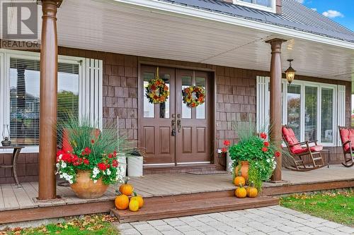 Stunning front entrance with French doors leading to front foyer. - 2176 County Road 22 Road, Cardinal, ON - Outdoor With Deck Patio Veranda