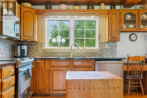 Kitchen includes butcher block as well.   West facing windows provides lots of light! - 2176 County Road 22 Road, Cardinal, ON - Indoor Photo Showing Kitchen