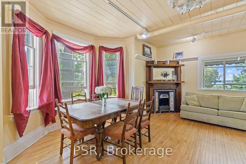 1020 Bala Falls Road, Muskoka Lakes, ON - Indoor Photo Showing Dining Room With Fireplace