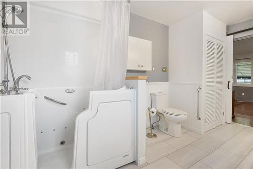 Convenient walkin tub/shower - 8 Spyglass Ridge, Stittsville, ON - Indoor Photo Showing Bathroom