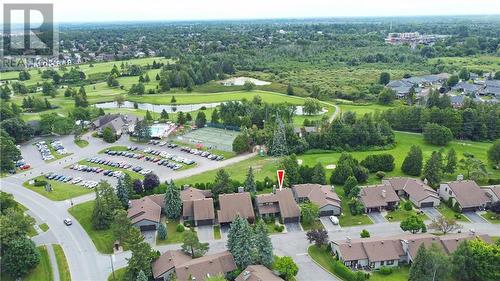 Nestled close to the Clubhouse, pool, pickleball and golf. All are just a short walk away or quick golfcart drive - 8 Spyglass Ridge, Stittsville, ON - Outdoor With View