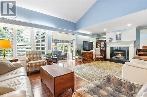 Hardwood floors are seamless throughout the  livingroom and diningroom - 8 Spyglass Ridge, Stittsville, ON - Indoor Photo Showing Living Room With Fireplace