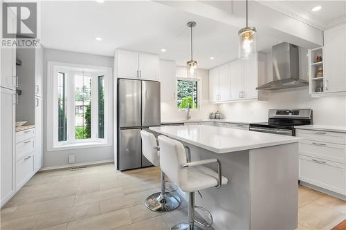 They went the extra mile and had the wall removed (with all the engineer approved specs) - 8 Spyglass Ridge, Stittsville, ON - Indoor Photo Showing Kitchen With Upgraded Kitchen