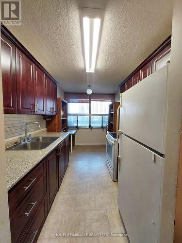 409 - 25 Kensington Road S, Brampton, ON - Indoor Photo Showing Kitchen With Double Sink