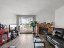 408-3270 Ross Rd, Nanaimo, BC  - Indoor Photo Showing Living Room With Fireplace 