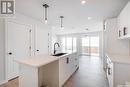 8620 Wheat Crescent, Regina, SK  - Indoor Photo Showing Kitchen With Double Sink With Upgraded Kitchen 