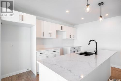 8620 Wheat Crescent, Regina, SK - Indoor Photo Showing Kitchen With Double Sink