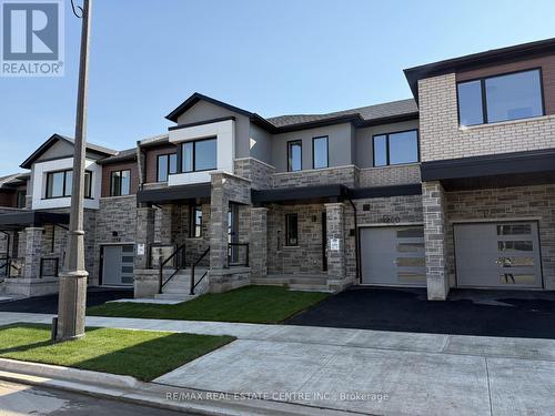 1250 Wheat Boom Drive, Oakville, ON - Outdoor With Facade