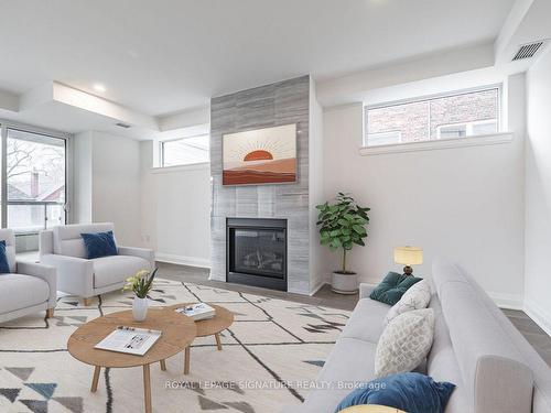 202-285 Avenue Rd, Toronto, ON - Indoor Photo Showing Living Room With Fireplace