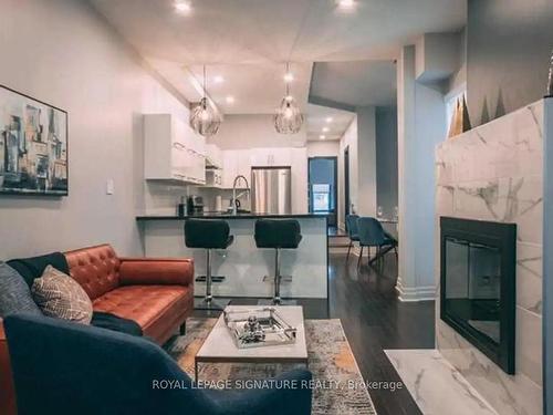 1-7 Bernard Ave, Toronto, ON - Indoor Photo Showing Living Room With Fireplace