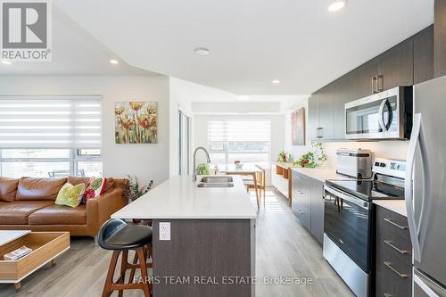 812 - 58 Lakeside Terrace, Barrie, ON - Indoor Photo Showing Kitchen With Double Sink