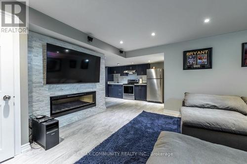 77 Vettese Court, Markham, ON - Indoor Photo Showing Living Room With Fireplace