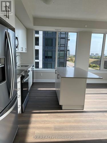 407 - 3220 William Coltson Avenue, Oakville, ON - Indoor Photo Showing Kitchen With Stainless Steel Kitchen