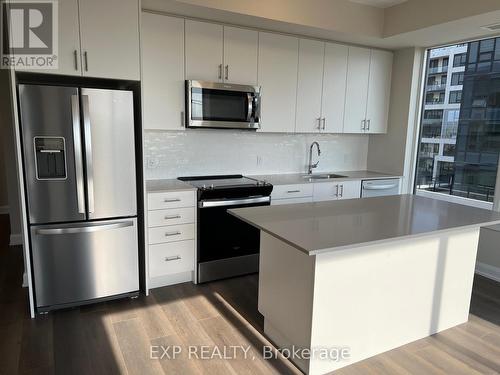 407 - 3220 William Coltson Avenue, Oakville, ON - Indoor Photo Showing Kitchen With Stainless Steel Kitchen