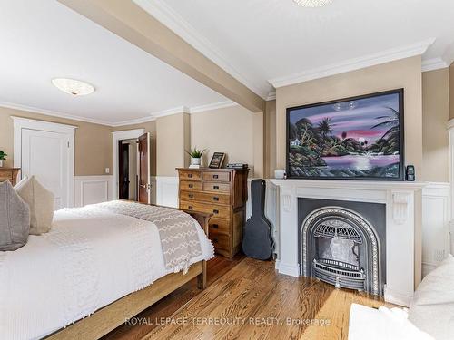 35 Joseph St, Toronto, ON - Indoor Photo Showing Bedroom With Fireplace