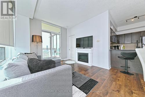 2902 - 3525 Kariya Drive, Mississauga, ON - Indoor Photo Showing Living Room With Fireplace