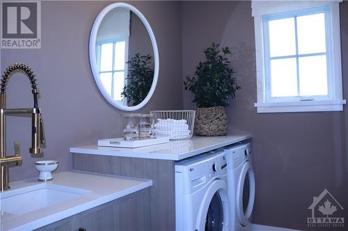 Upper level Laundry in similar decorated model. - 783 Kenny Gordon Avenue, Ottawa, ON - Indoor Photo Showing Laundry Room