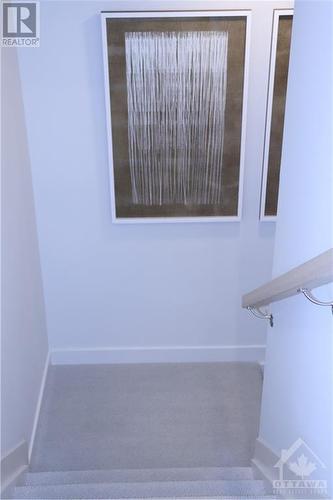 Stairs fully finished to the lower level in similar decorated model - 783 Kenny Gordon Avenue, Ottawa, ON - Indoor Photo Showing Other Room